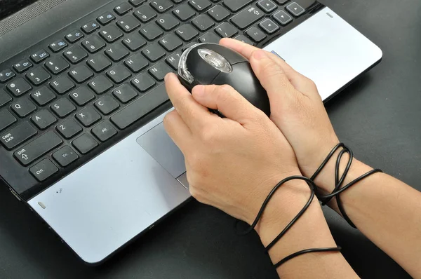 Woman hand hold and were bond with computer mouse, internet addi — Stock Photo, Image