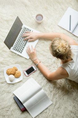 Young woman studying using technology