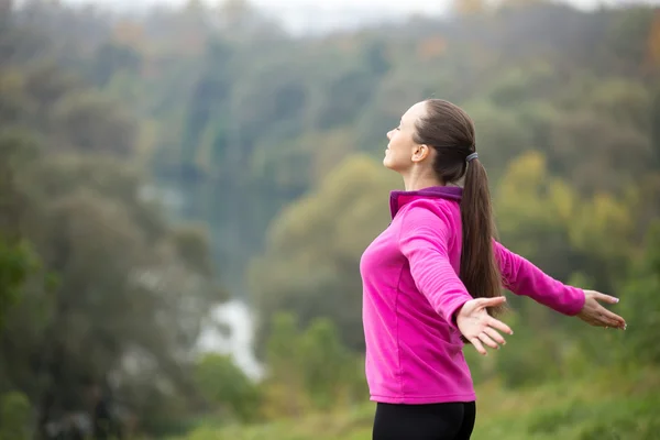 Portrait of an attractive woman outdoors in a sportswear