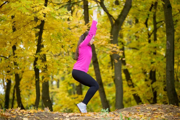 Yoga outdoors: Chair posture — Stock Photo, Image