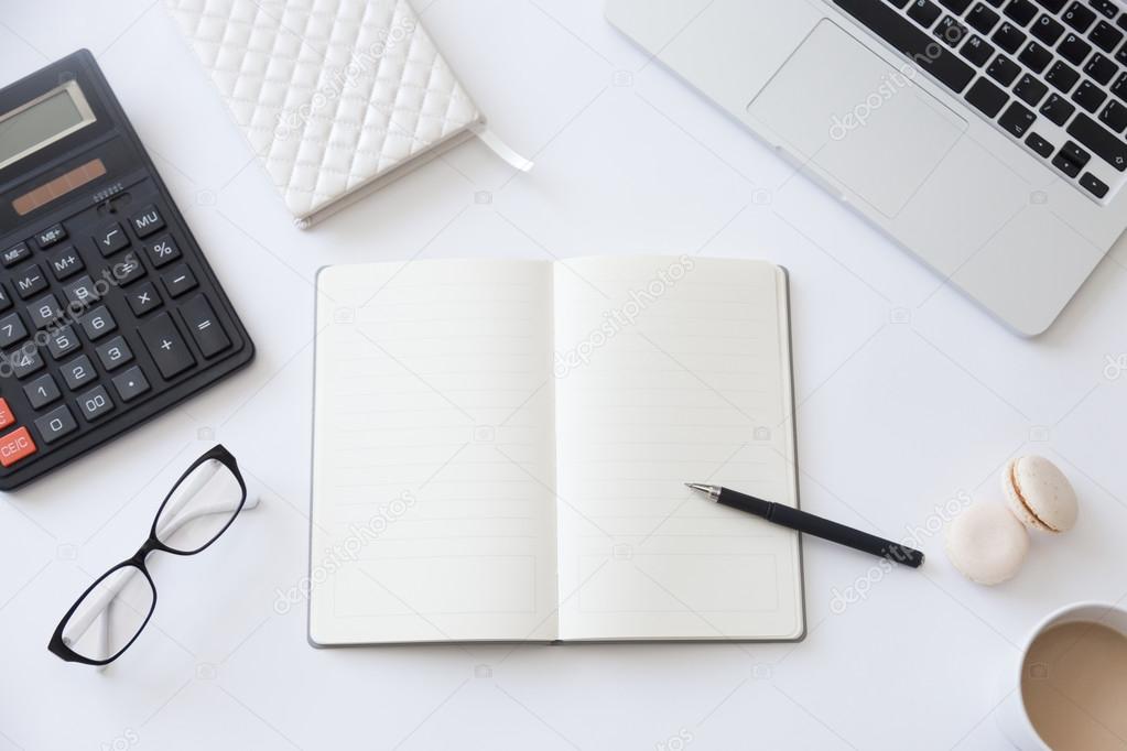 Top view of a working desk with open notebook ⬇ Stock Photo, Image by © fizkes #126998082