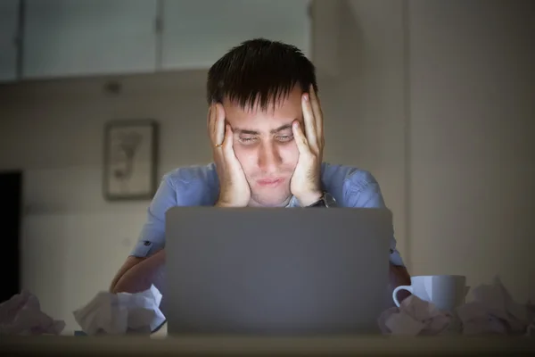 Portrait of a man at the desk near laptop, late night — Stock Photo, Image