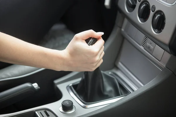 Close-up of female hand tuning vehicle audio — Stock Photo, Image
