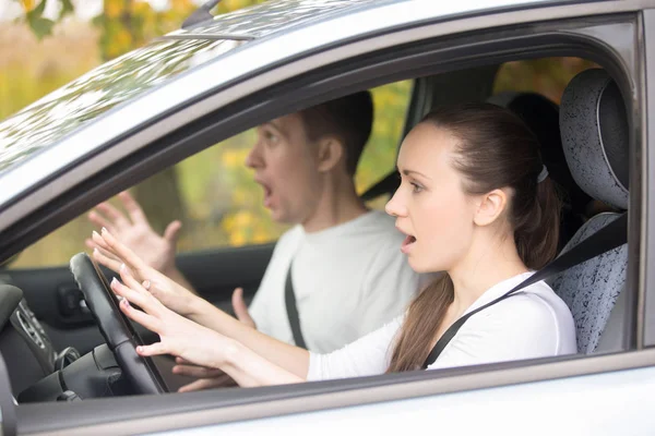 Young frightened driver woman and a man — Stock Photo, Image