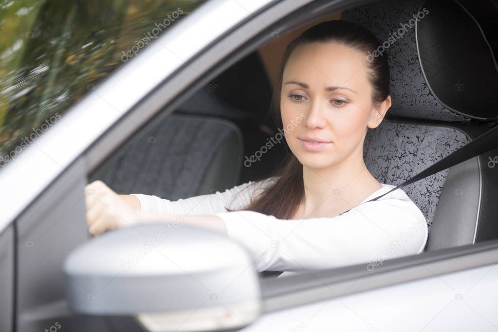 Woman buckling a seat belt
