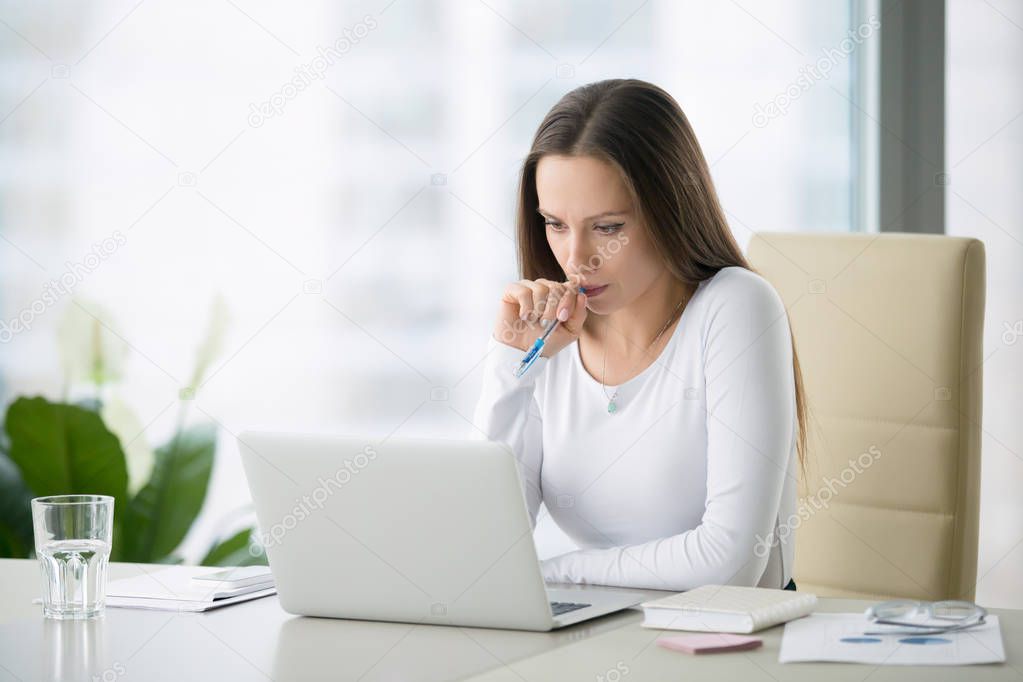 Young woman near laptop