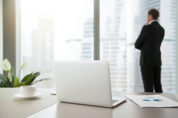 Confident business man contemplating in his office — Stock Photo, Image