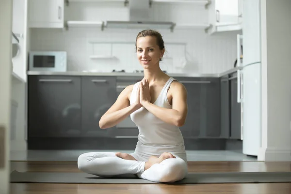 Smiling woman sitting in Lotus exercise — Stock Photo, Image