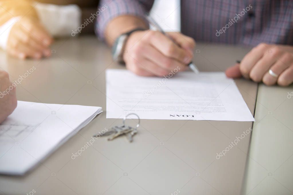 Close up of signing a loan