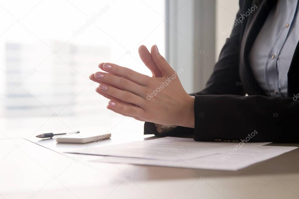 Close up of female hands put together, concentration or nerves