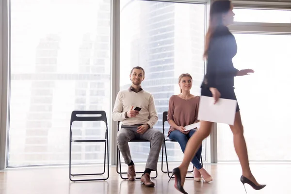 Job candidates gloating over female competitor walking after uns — Stock Photo, Image