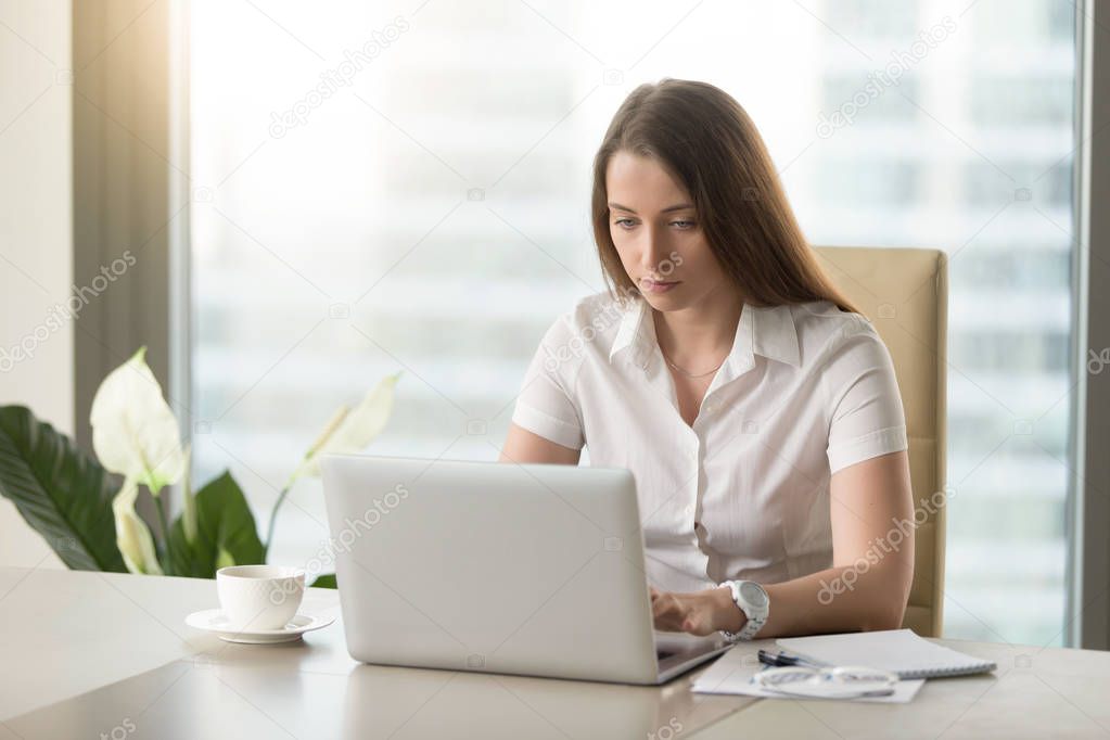 Female office worker doing everyday work routine