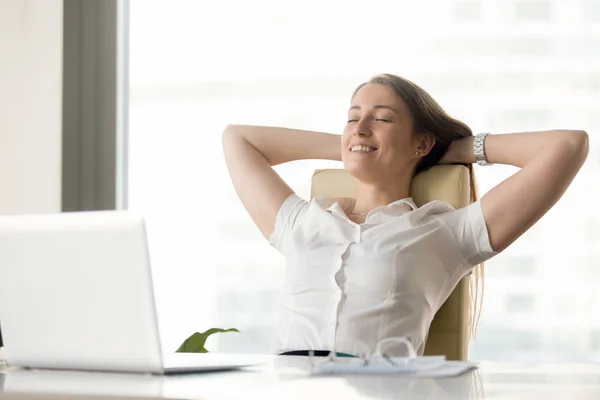 Cheerful businesswoman dreaming at workplace — Stock Photo, Image