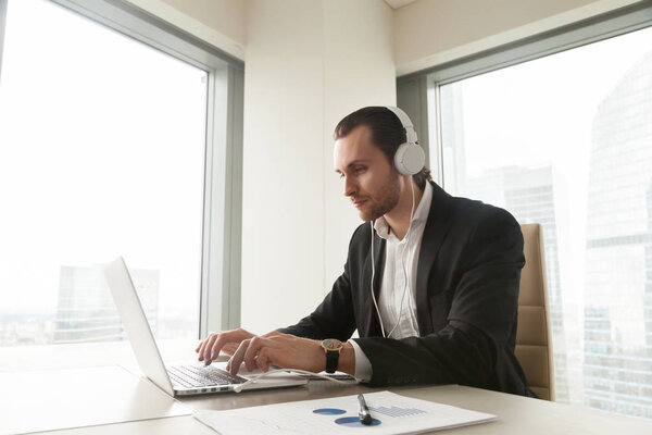 Businessman takes part in online conference