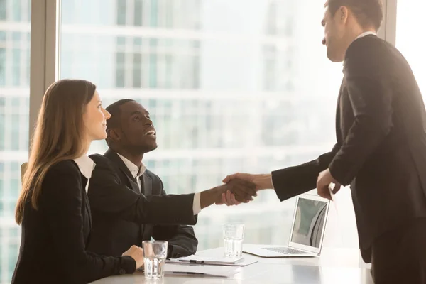 Black and white recruitment officers welcoming applicant arrived — Stock Photo, Image