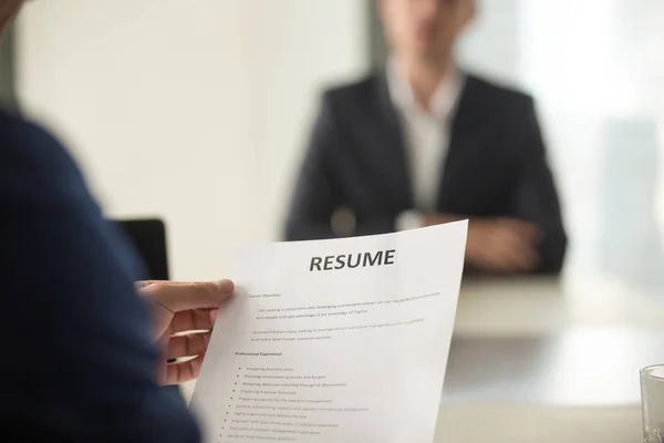 Job interview in office, focus on resume, close up view — Stock Photo, Image