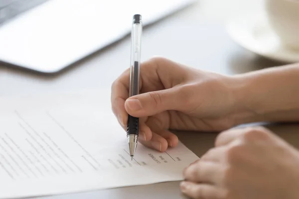 Female hand putting signature on document, signing official pape — Stock Photo, Image