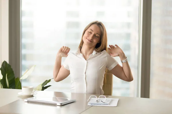 Happy satisfied businesswoman stretching at workplace, finished — Stock Photo, Image