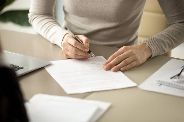 Woman signing document, focus on female hand putting signature, — Stock Photo, Image