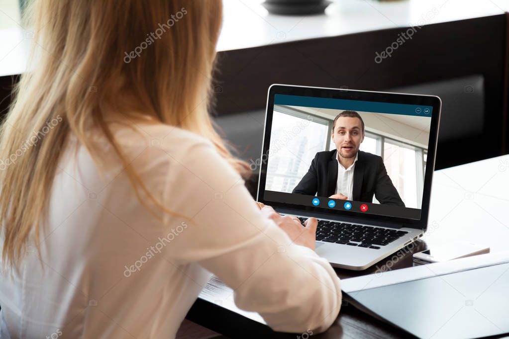 Businesswoman making video call to business partner, webcam chat