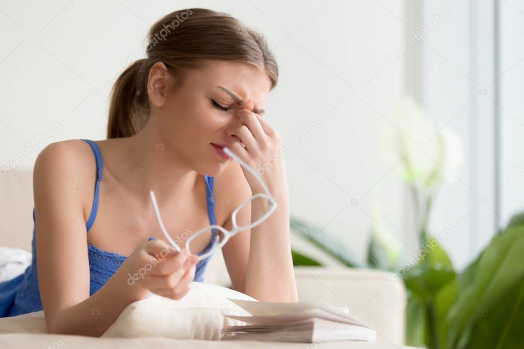 Lady feeling headache or dizziness while reading