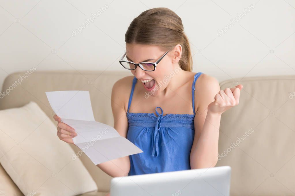 Happy smiling lady reading letter with good news