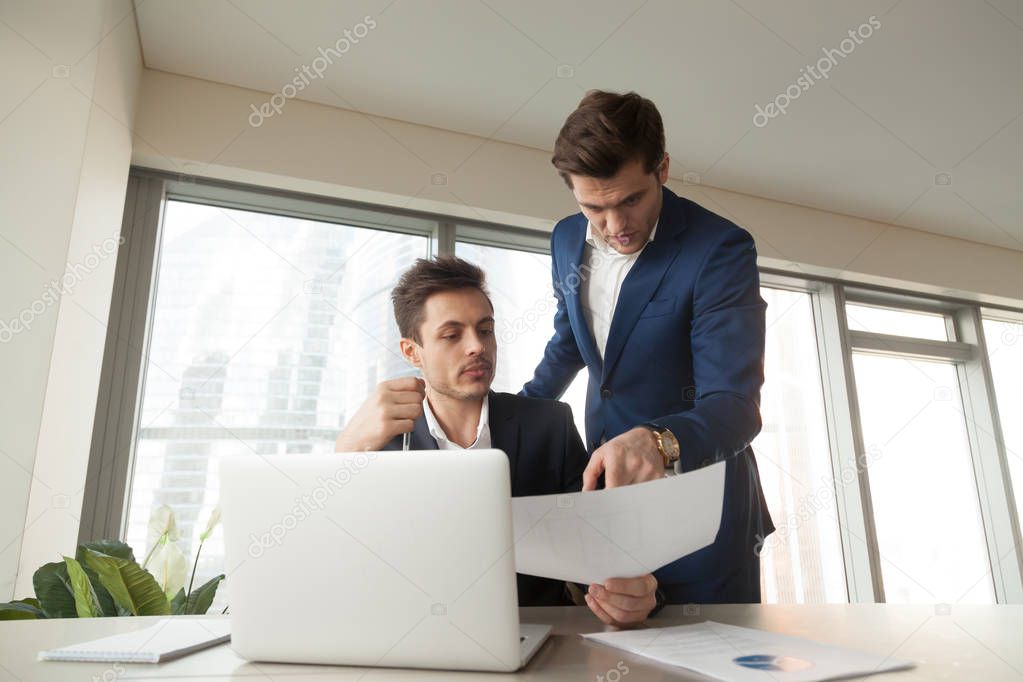 Boss asking architect to make corrections in plan