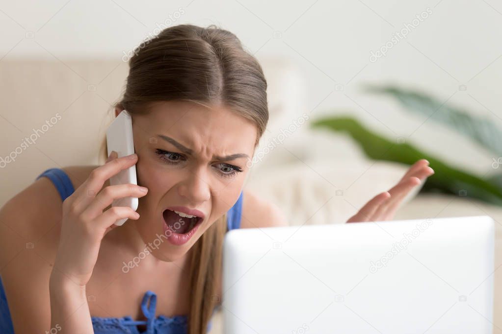 Angry dissatisfied young woman calling customer support, arguing