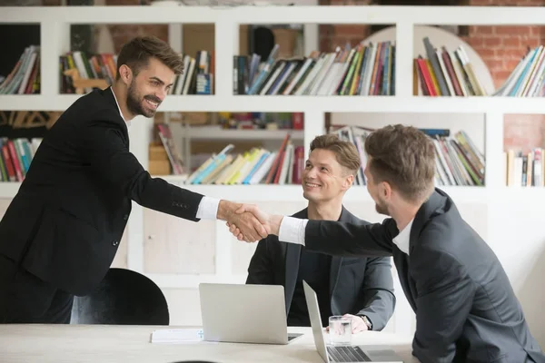 Businessman greeting welcoming new partner or making deal with h — Stock Photo, Image