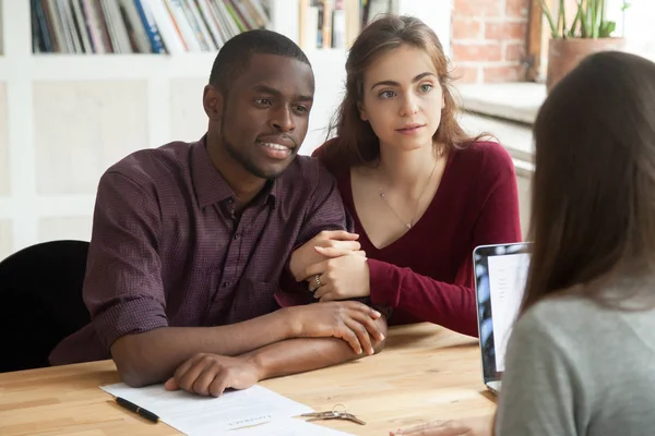 Multiethnic couple considering mortgage investment real estate p — Stock Photo, Image