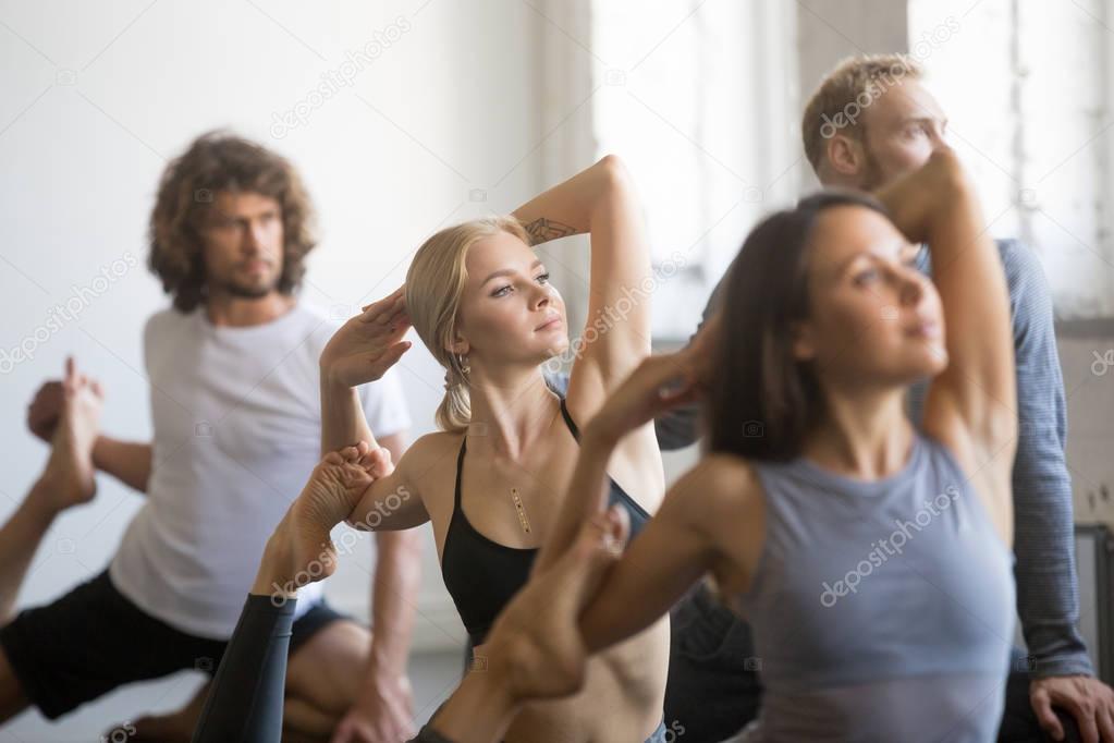 Group of young sporty people in Mermaid pose