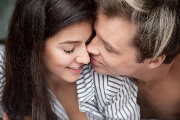 Closeup of romantic couple tender gentle touching face to face — Stock Photo, Image