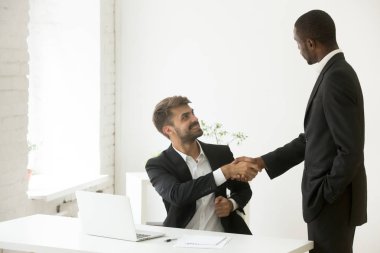African-american boss congratulating caucasian employee with pro clipart