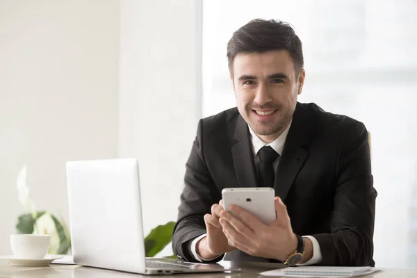 Happy head manager working with gadgets in office — Stock Photo, Image