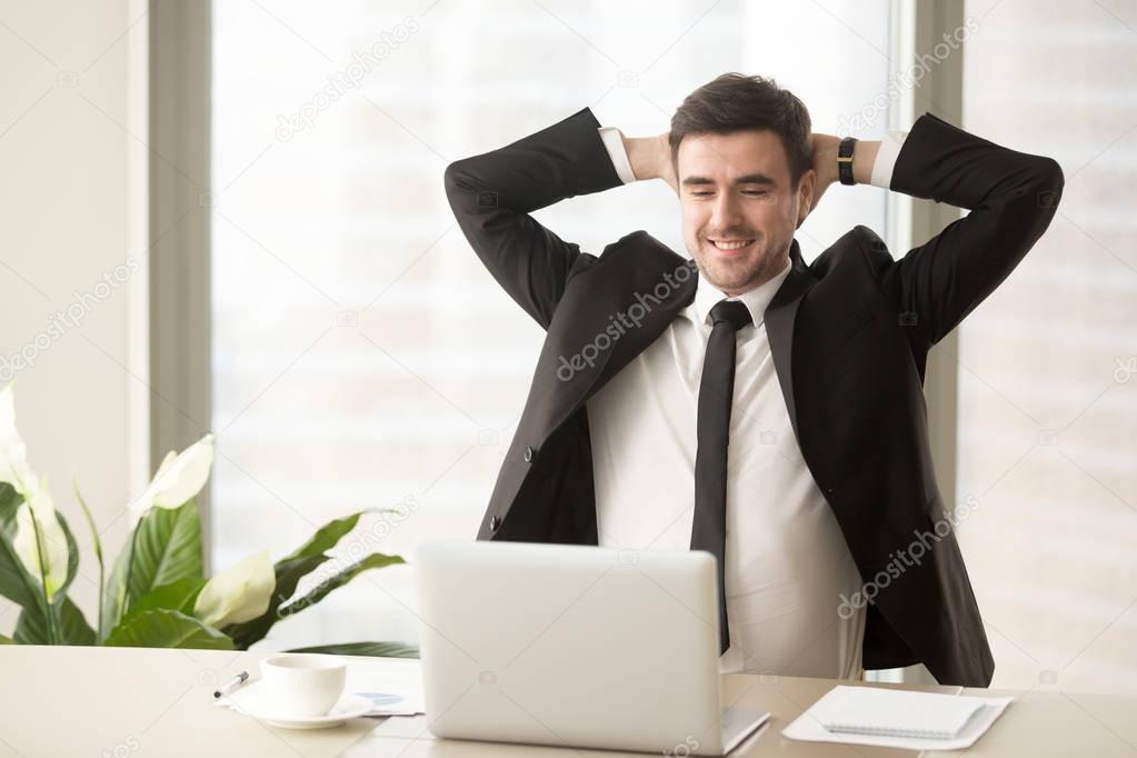 Relaxed employee enjoying result of good job done