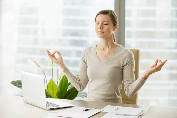 Calm businesswoman relaxing with breath gymnastics — Stock Photo, Image