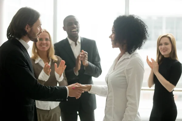 Grateful boss handshaking promoting african businesswoman congra — Stock Photo, Image