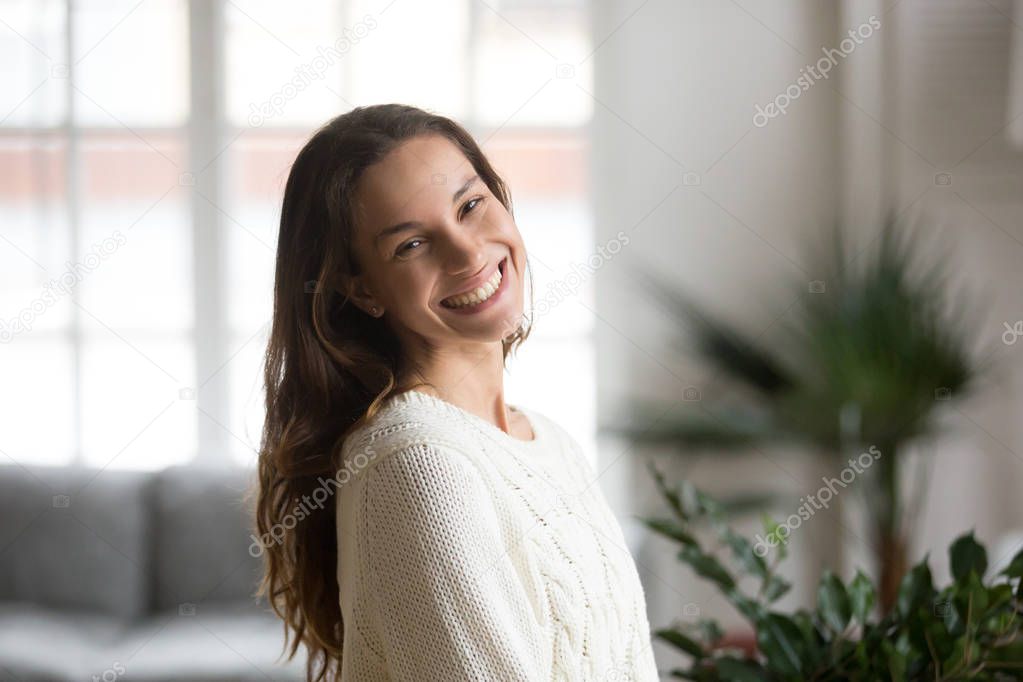 Cheerful happy mestizo girl with beautiful smile looking at came