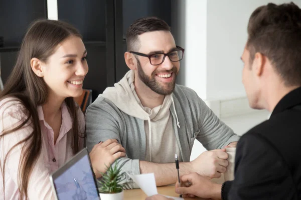 Excited smiling millennial couple discussing mortgage loan inves — Stock Photo, Image