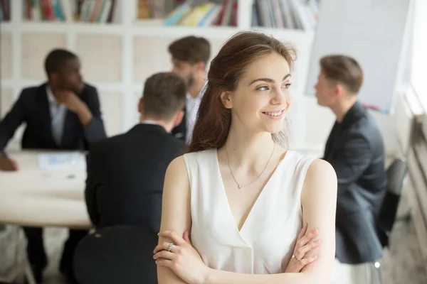 Business woman looking to side at corporate meeting — Stock Photo, Image