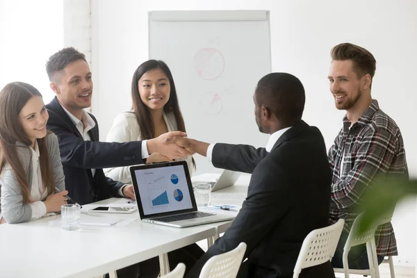 Satisfied multiracial businessmen handshaking after successful g — Stock Photo, Image