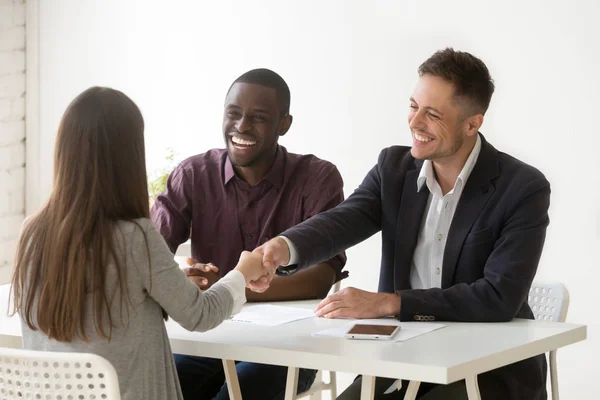 Smiling hr handshaking female applicant at job interview, hiring — Stock Photo, Image