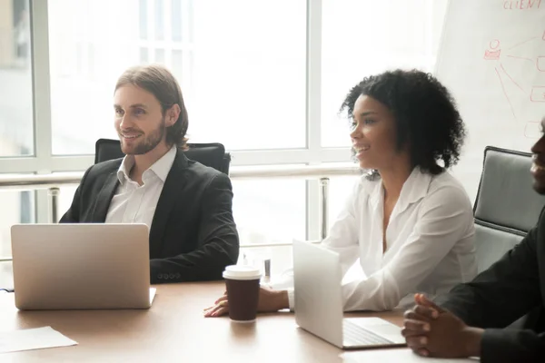 Multiracial smiling business people participating group meeting — Stock Photo, Image