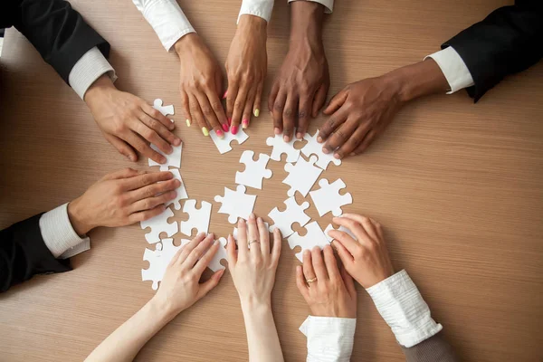 Hands Diverse People Connecting Puzzle Together Office Desk Multi Ethnic — Stock Photo, Image