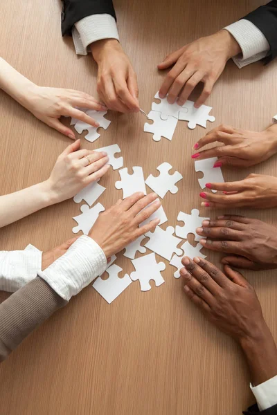 Multiracial Team Assembling Puzzle Together Hands Diverse People Connecting Pieces — Stock Photo, Image