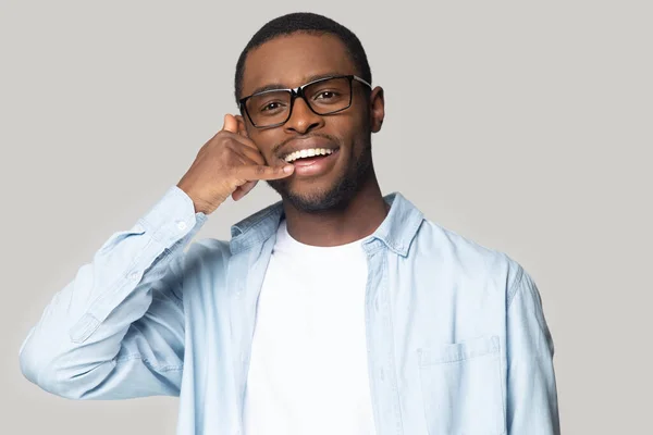 Head shot happy African American man showing call me gesture — Stock Photo, Image