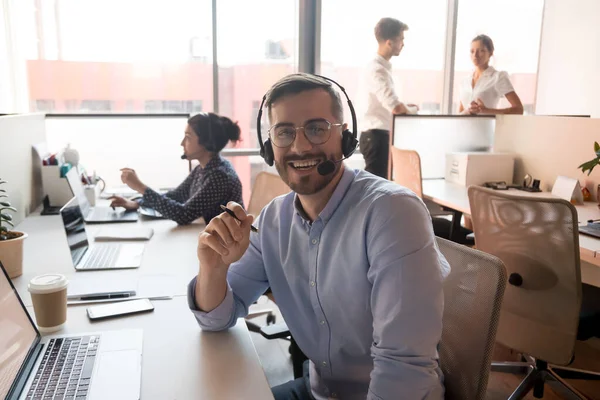 Millennial happy male call center agent looking into camera. — Stock Photo, Image