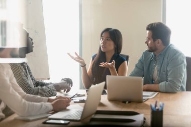 Annoyed diverse employees arguing at briefing, discussing contract terms