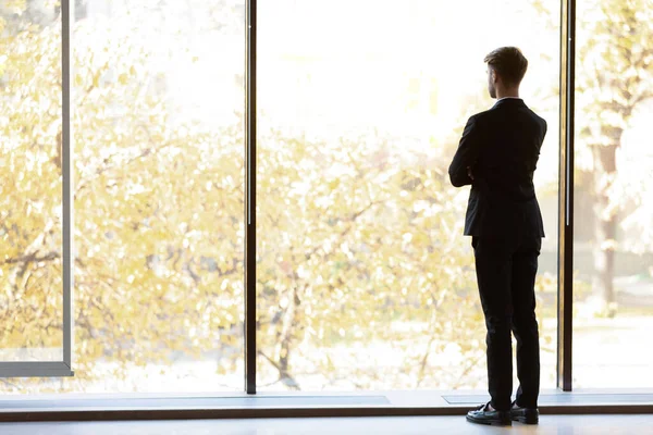 Back view of businessman look in distance thinking — Stock Photo, Image