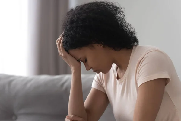 Unhappy exhausted African American woman thinking about problems close up — Stock Photo, Image